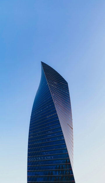 black and gray high rise building under blue sky during daytime