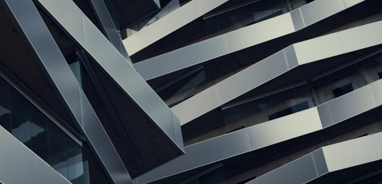 low angle photography of gray building at daytime